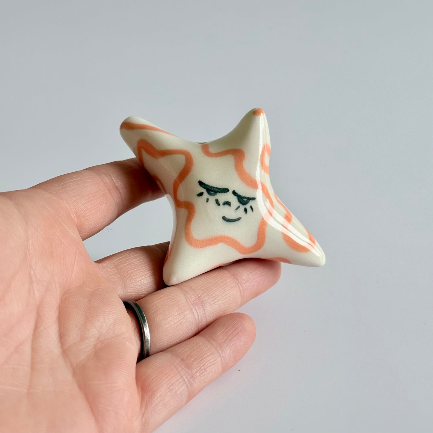 Ceramic sleepy star face