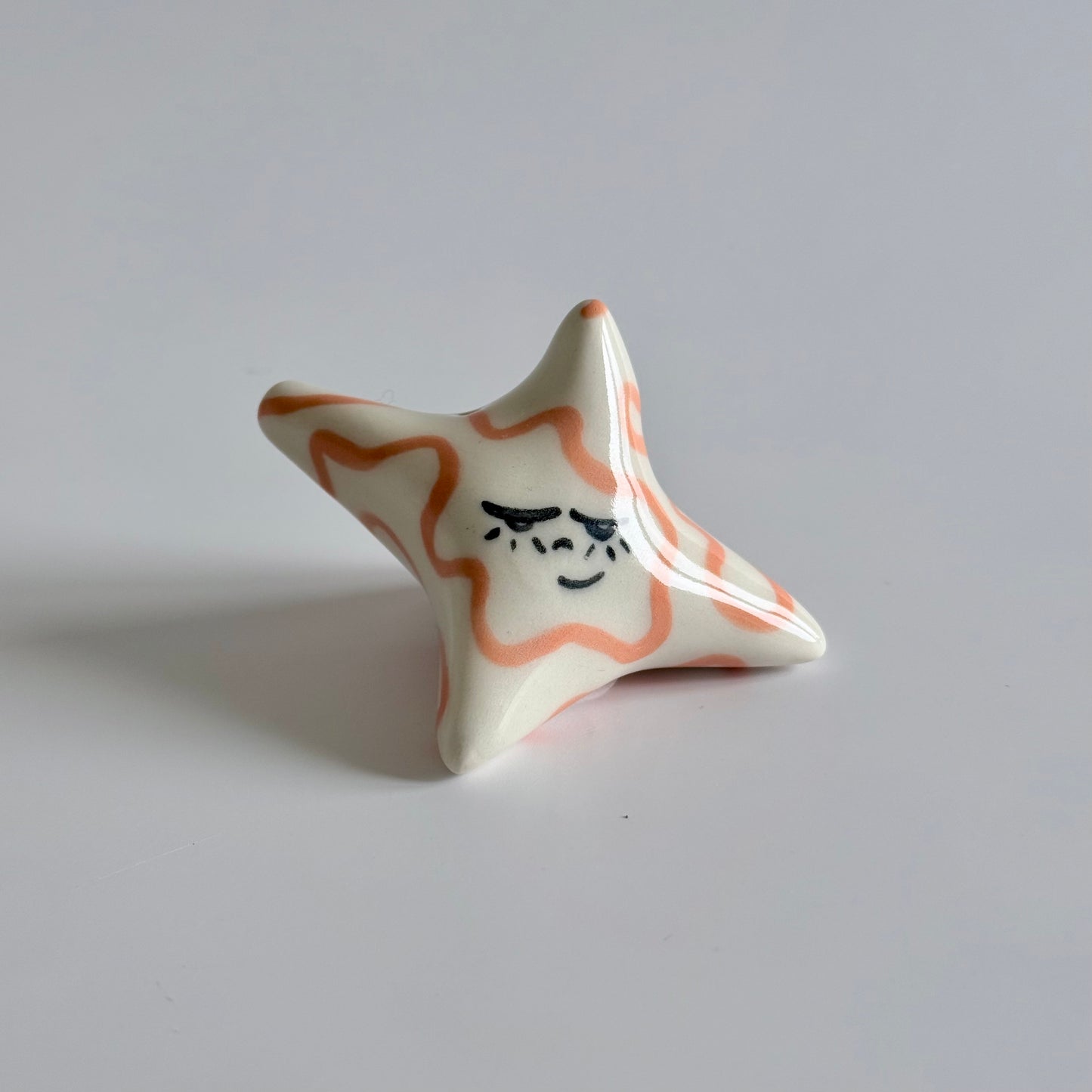 Ceramic sleepy star face