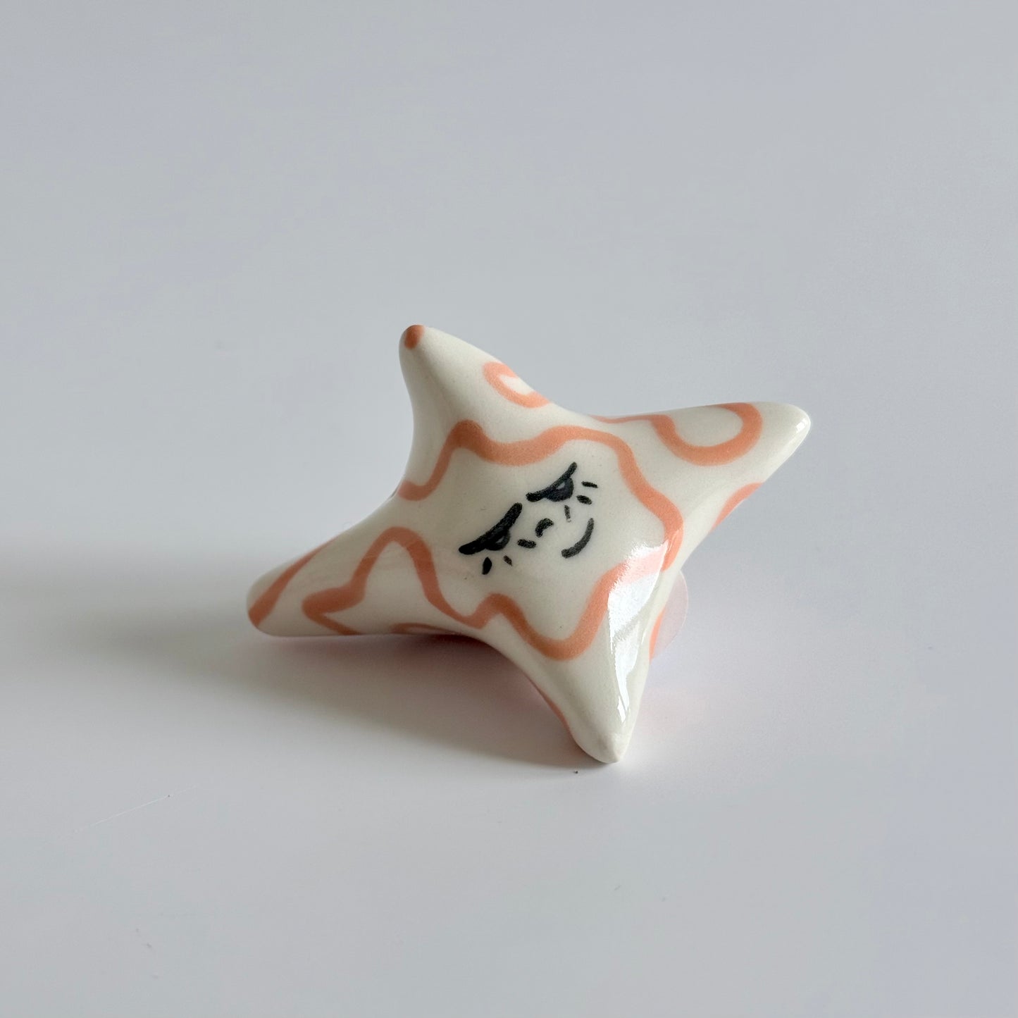 Ceramic sleepy star face
