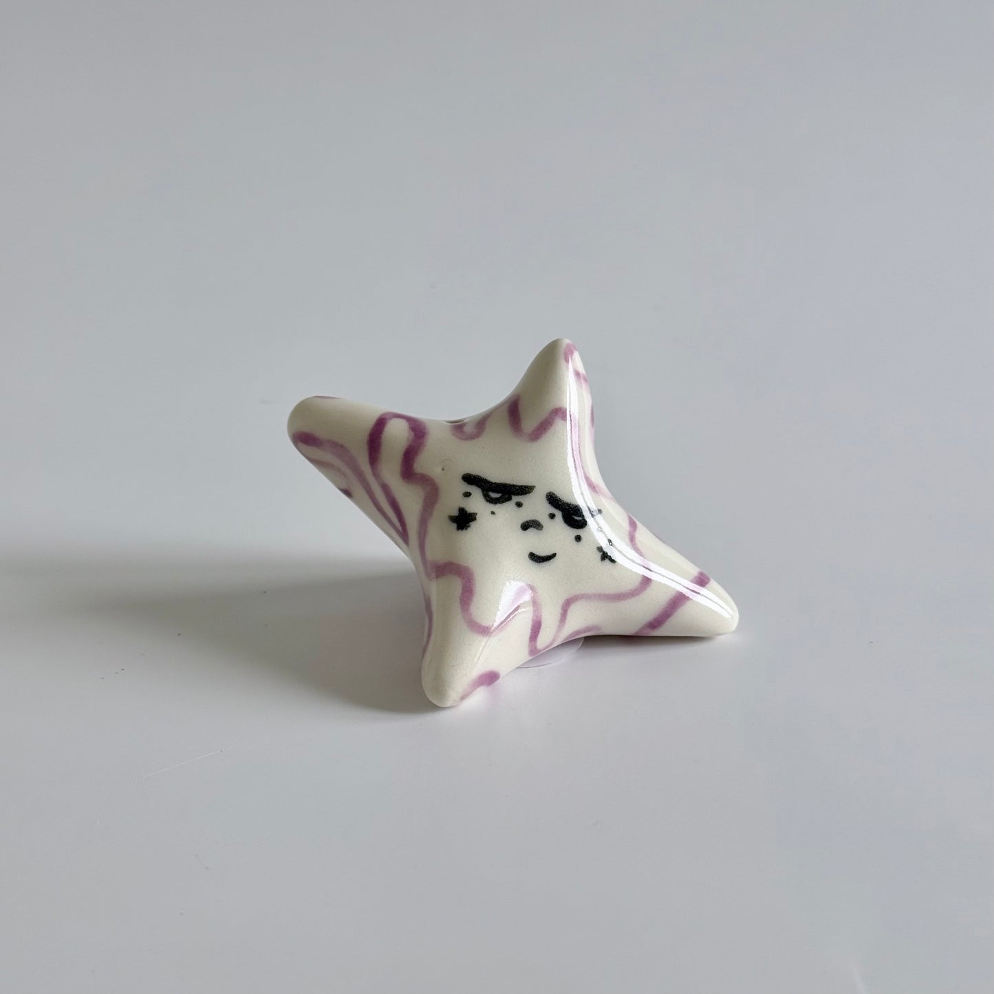 Ceramic sleepy star face